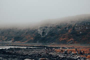 fog over cliffs that look like skull