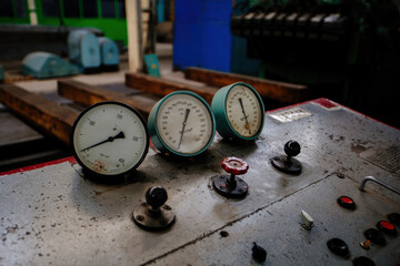 Control panel with buttons and pressure gauge