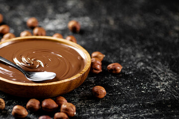 Hazelnut butter in a plate with a spoon. 