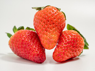 Ripe strawberries on a white background. Strawberries close up.