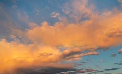 Naklejka na ściany i meble Beautiful bright sunset sky with clouds. Sunset sky background.