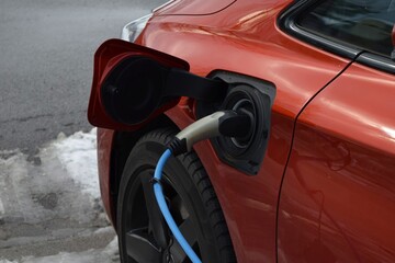 charging an electric car at a charging station
