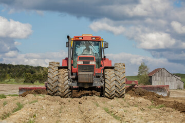 Agricultural land leveler machinery in field on a beautiful spring day. Agriculture. Tractor. Farmland. Farming. Land leveler. 