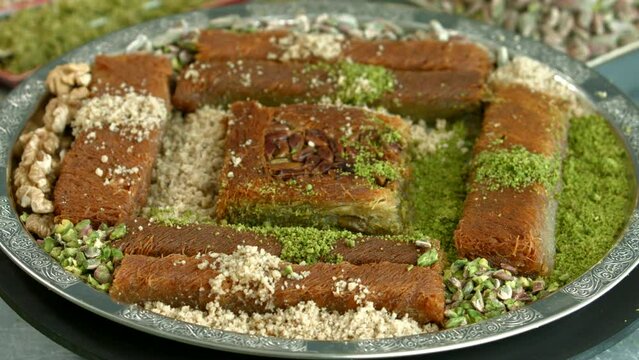 Traditional turkish baklava pistachio pastry. Dilberdudagi, ozel kesim baklava, cikolatali baklava, fistikli baklava, katmer, fistikli kadayif, kattafi, fistik sarma, soguk baklava, midye baklava, cev