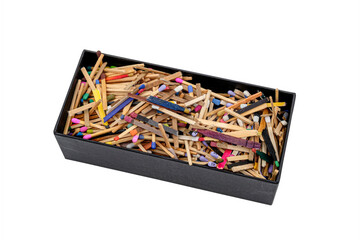 big black cardboard box with matchsticks of various shapes and colors