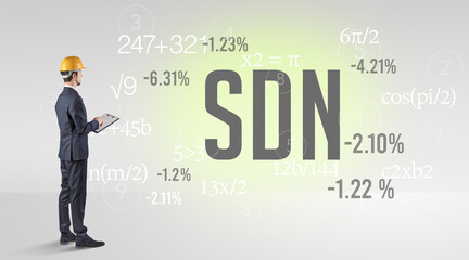 Engineer in hard hat with abbreviation