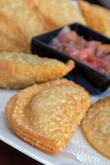 Brazilian bar food: portion of pastel whit vinaigrette