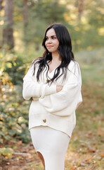 Portrait of attractive smiling caucasian brunette woman. The face of a happy and relaxing beautiful woman with long hair outdoor. Looking Happy, feeling liberty. Ukrainian Girl.