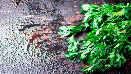 Parsley on a damp table.