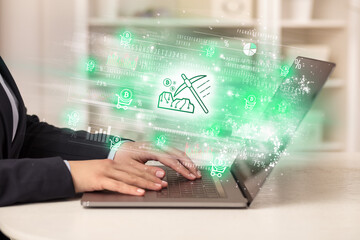 Young man watching stock market on laptop