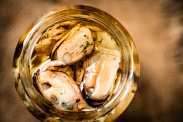 Pickled mussels in a glass jar. 