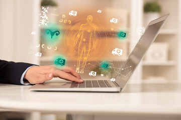 Doctor working on laptop with healthcare concept