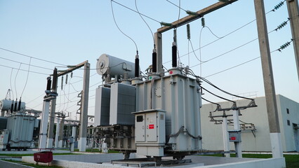 Power transformer. Electrical equipment. Electric substation. High voltage transformer against the...