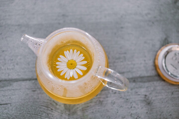 Cup of tea with chamomile flowers 