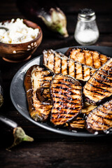 A plate with grilled pieces of eggplant. 