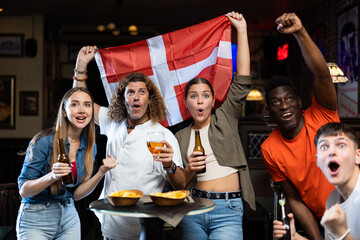 Danish fans scream with joy in a beer bar. Denmark win