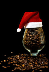 Roasted coffee beans with a New Year's toy