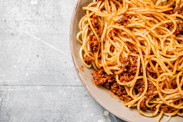 Homemade spaghetti bolognese. On a gray background.