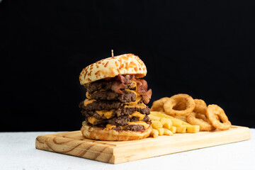 Burger cheese with potato in wooden table and black backgournd 
