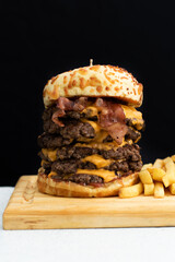 Burger cheese with potato in wooden table and black backgournd 