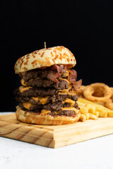 Burger cheese with potato in wooden table and black backgournd 