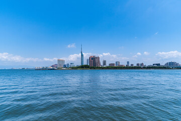 Fototapeta premium Cityscape view from sea in Fukuoka city, Japan.