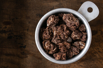Chocolate Nut Coconut Granola in a Measuring Cup