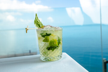 Daisy with mint with the background of the sea