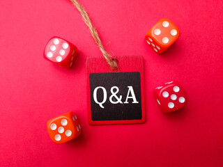 Colored dice with the word Q AND A. Business concept.