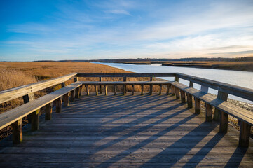 Obraz premium A viewing platform and dock in the marsh grasses near the ocean
