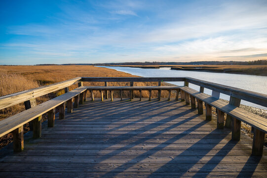 A viewing platform and dock in the marsh grasses near the ocean