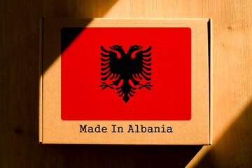 Made in Albania. Cardboard boxes with text "Made In Albania" and the Flag of Albania.