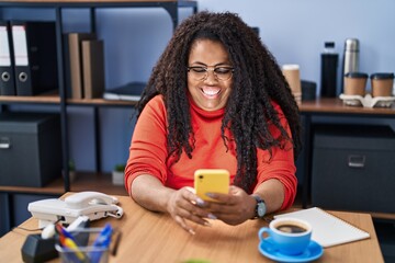 African american woman business worker using smartphone drinking coffee at office