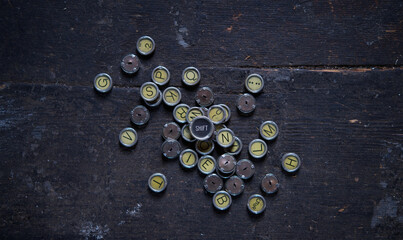 Pile of vintage, antique typewriter keys.	
