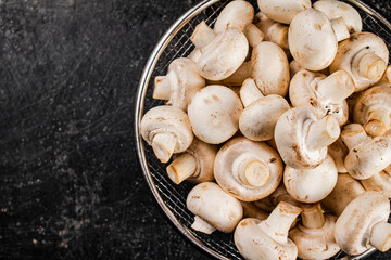 Fresh mushrooms in a colander. 