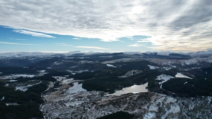 Snowdonia, Wales (UK), Winter 2023. Aerial landscapes of snow and mountains.