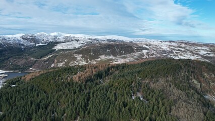 Snowdonia, Wales (UK), Winter 2023. Aerial landscapes of snow and mountains.