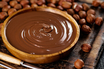 Hazelnut butter in a plate on a cutting board. 