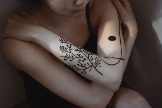 Portrait Of Asian Woman With Henna Tattoo