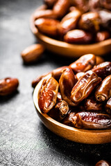 Fototapeta premium Two plates of dates on the table. 