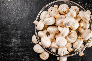 Fresh mushrooms in a colander. 