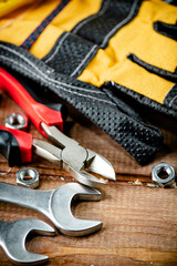 Wrenches with nuts on the table. 