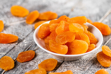 Fragrant dried apricots in a bowl on the table. 