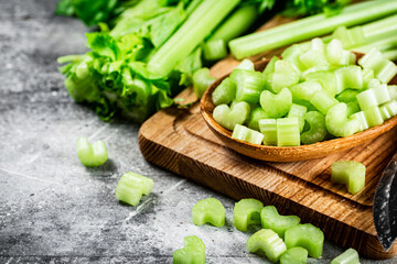 Sliced celery on a cutting board. 