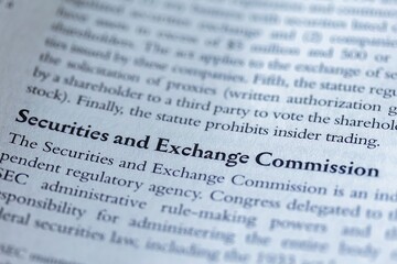 legal or law book with SEC or securities and exchange commission focused in closeup of explanation 