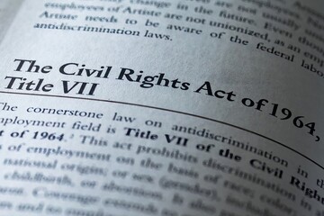 legal or law book with Civil rights act of 1964 Title VII focused in closeup of explanation  - obrazy, fototapety, plakaty