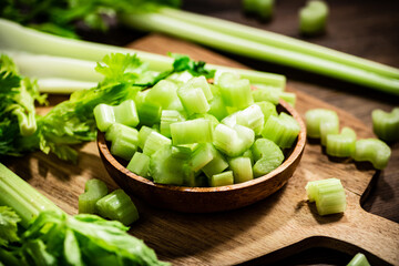 Sliced fresh celery on a cutting board. 