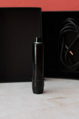 Black and green rotary tattoo machine