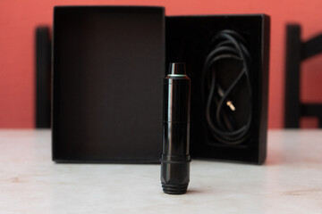 Black and green rotary tattoo machine