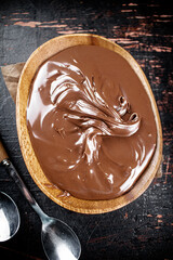 Hazelnut butter in a plate with a spoon. 